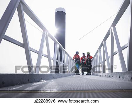 Offshore windfarm engineers in port on walkway View Large Photo Image Stock Photograph - Offshore windfarm engineers in port on walkway. Fotosearch