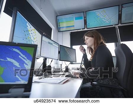 Operator in offshore windfarm control room View Large Photo Image Picture - Operator in offshore windfarm control room. Fotosearch