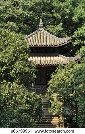 Stock Image - "Pavilion on mountains, surrounded by trees, Hangzhou, China". Fotosearch