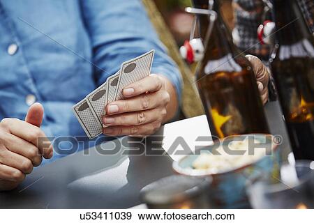 "Person holding playing cards, close up" View Large Photo Image Stock Photo - "Person holding playing cards, close up". Fotosearch