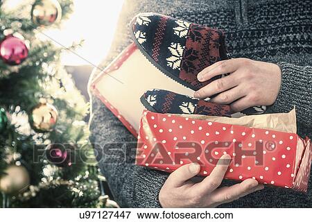 Person opening pair of slippers View Large Photo Image Stock Photo - Person opening pair of slippers. Fotosearch