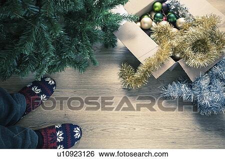 "Person wearing slippers with christmas decorations, high angle" View Large Photo Image Stock Photograph - "Person wearing slippers with christmas decorations, high angle". Fotosearch