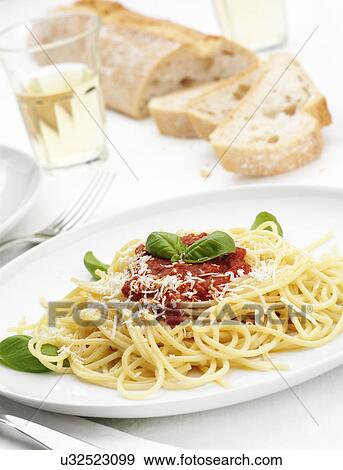 Plate of spaghetti al sugo di pomodoro View Large Photo Image Stock Photo - Plate of spaghetti al sugo di pomodoro. Fotosearch