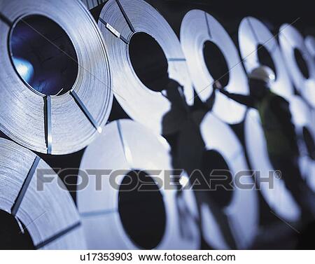 Port worker with steel rolls in port View Large Photo Image Stock Image - Port worker with steel rolls in port. Fotosearch