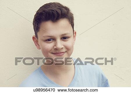 Portrait of boy in front of wall View Large Photo Image Stock Image - Portrait of boy in front of wall. Fotosearch