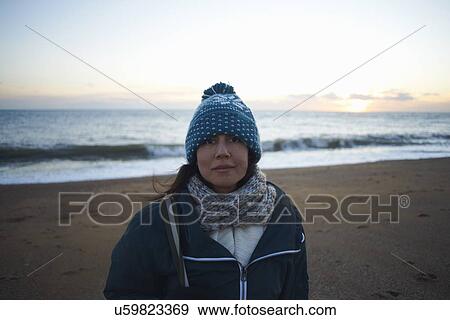 Portrait of mature woman wearing knitted hat on beach at dusk View Large Photo Image Stock Photo - Portrait of mature woman wearing knitted hat on beach at dusk. Fotosearch