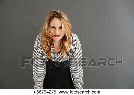 Portrait of mid adult woman looking at camera View Large Photo Image Stock Photography - Portrait of mid adult woman looking at camera. Fotosearch