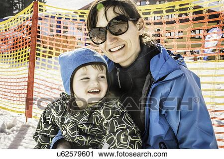 "Portrait of mother and son, wearing skiwear, smiling" View Large Photo Image Stock Image - "Portrait of mother and son, wearing skiwear, smiling". Fotosearch