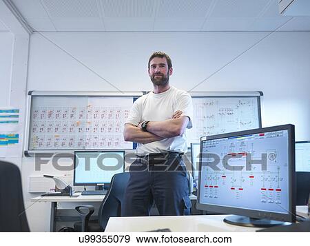 Portrait of offshore windfarm engineer in office View Large Photo Image Stock Photo - Portrait of offshore windfarm engineer in office. Fotosearch