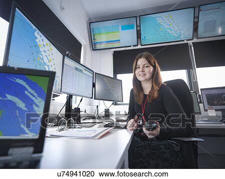 Stock Image - Portrait of operator in offshore windfarm control room. Fotosearch
