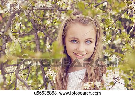 Portrait of pretty girl and tree blossom View Large Photo Image Stock Photo - Portrait of pretty girl and tree blossom. Fotosearch
