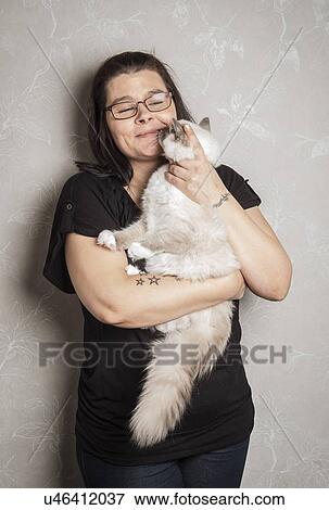 Stock Photo - Portrait of Ragdoll cat with owner. Fotosearch