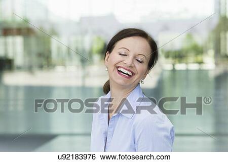 Portrait of smiling mature woman View Large Photo Image Stock Photograph - Portrait of smiling mature woman. Fotosearch
