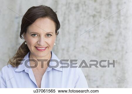 Stock Photography - Portrait of smiling mature woman. Fotosearch