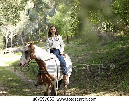 Stock Photograph - Portrait of teenage girl bareback riding horse. Fotosearch