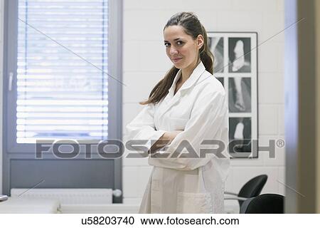 Stock Image - Portrait of young female orthopedic doctor in clinic. Fotosearch