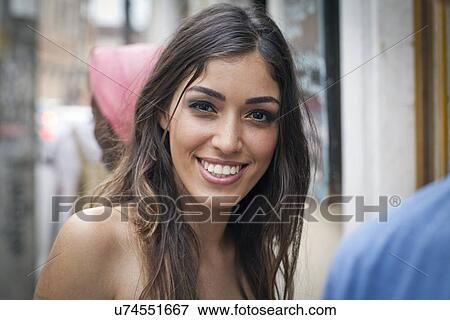 "Portrait of young woman, looking at camera, smiling" View Large Photo Image Stock Photo - "Portrait of young woman, looking at camera, smiling". Fotosearch