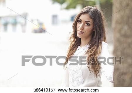 "Portrait of young woman, pensive expression" View Large Photo Image Stock Photo - "Portrait of young woman, pensive expression". Fotosearch