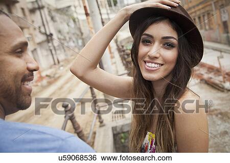 "Portrait of young woman with friend, looking at camera, smiling" View Large Photo Image Stock Photograph - "Portrait of young woman with friend, looking at camera, smiling". Fotosearch