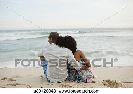"Rear view of couple looking out to sea from beach, Rio De Janeiro, Brazil" View Large Photo Image Stock Image - "Rear view of couple looking out to sea from beach, Rio De Janeiro, Brazil". Fotosearch