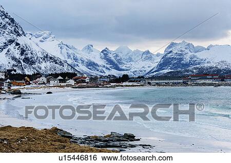 Stock Photograph - "Reine fishing village covered in snow, Norway". Fotosearch