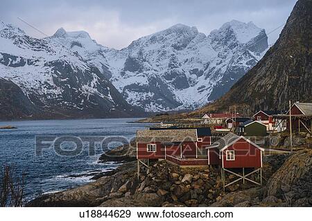 Stock Photo - "Reine fishing village with snow capped mountains, Norway". Fotosearch