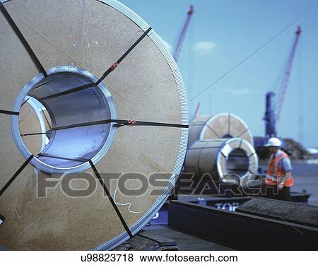 "Rolls of steel being loaded in port, Grimsby, England, United Kingdom" View Large Photo Image Stock Photo - "Rolls of steel being loaded in port, Grimsby, England, United Kingdom". Fotosearch