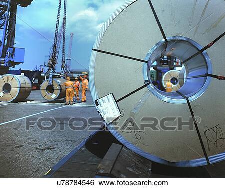 Stock Photograph - "Rolls of steel being loaded in port, Grimsby, England, United Kingdom". Fotosearch