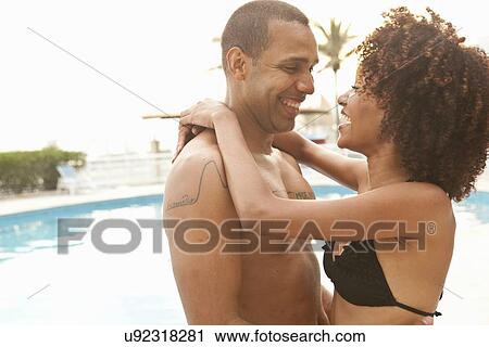 "Romantic couple at hotel poolside, Rio De Janeiro, Brazil" View Large Photo Image Stock Image - "Romantic couple at hotel poolside, Rio De Janeiro, Brazil". Fotosearch