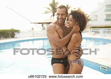 "Romantic couple hugging at hotel poolside, Rio De Janeiro, Brazil" View Large Photo Image Stock Photography - "Romantic couple hugging at hotel poolside, Rio De Janeiro, Brazil". Fotosearch