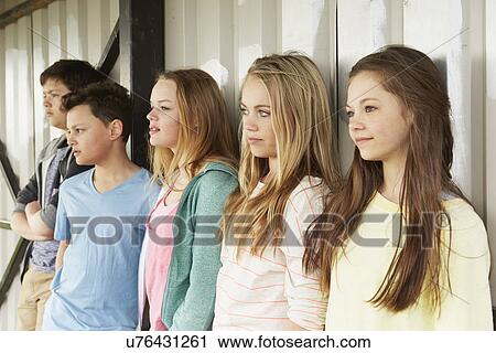 Row of five girls and boys looking out from shelter View Large Photo Image Stock Image - Row of five girls and boys looking out from shelter. Fotosearch