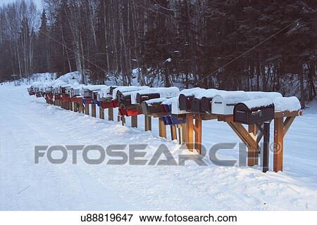 Stock Photo - "Row of mail boxes in snow, Fairbanks, Alaska". Fotosearch