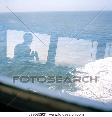 Sailor's reflection in window of container ship at sea View Large Photo Image Stock Image - Sailor's reflection in window of container ship at sea. Fotosearch