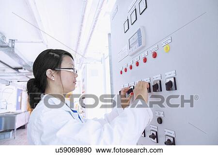 Scientist in control room View Large Photo Image Stock Image - Scientist in control room. Fotosearch