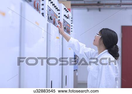 Stock Photography - Scientist in control room. Fotosearch