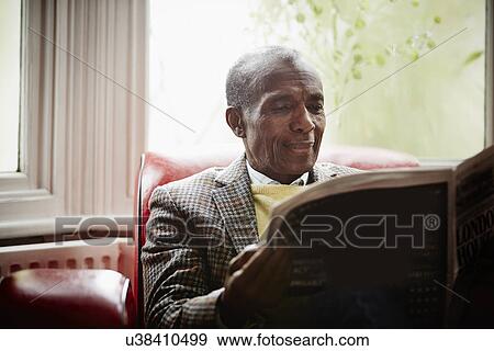 Senior man reading newspaper View Large Photo Image Stock Photo - Senior man reading newspaper. Fotosearch