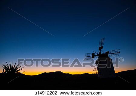 "Silhouette of Molino de el Roque at dawn, Fuerteventura, Spain" View Large Photo Image Stock Image - "Silhouette of Molino de el Roque at dawn, Fuerteventura, Spain". Fotosearch