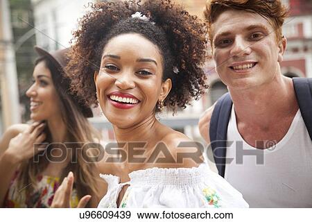 "Small group of friends, looking at camera, smiling" View Large Photo Image Stock Photo - "Small group of friends, looking at camera, smiling". Fotosearch