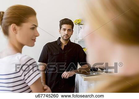 Stock Image - Small group of people at work. Fotosearch