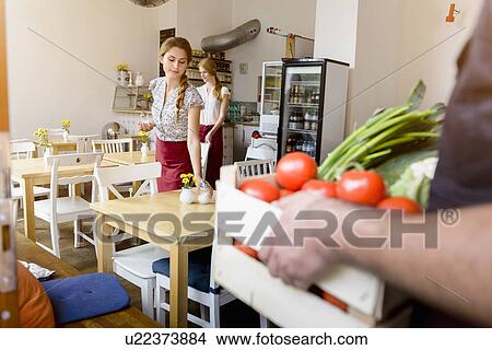 Small group of people working in cafe View Large Photo Image Picture - Small group of people working in cafe. Fotosearch