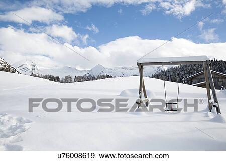 "Snow covered swing, Tyrol, Austria" View Large Photo Image Stock Photo - "Snow covered swing, Tyrol, Austria". Fotosearch