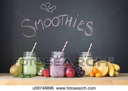 Still life of three fresh smoothies in front of blackboard View Large Photo Image Stock Photograph - Still life of three fresh smoothies in front of blackboard. Fotosearch
