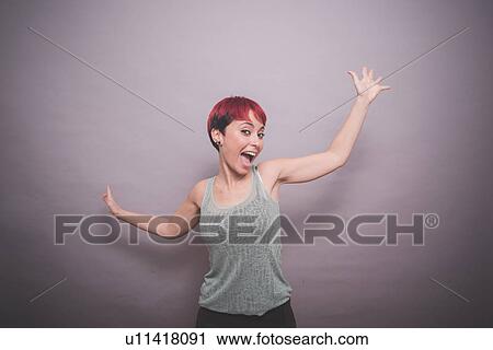 Studio portrait of young woman with short pink hair dancing View Large Photo Image Stock Image - Studio portrait of young woman with short pink hair dancing. Fotosearch
