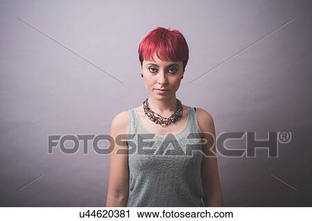 Studio portrait of young woman with short pink hair View Large Photo Image Stock Image - Studio portrait of young woman with short pink hair. Fotosearch