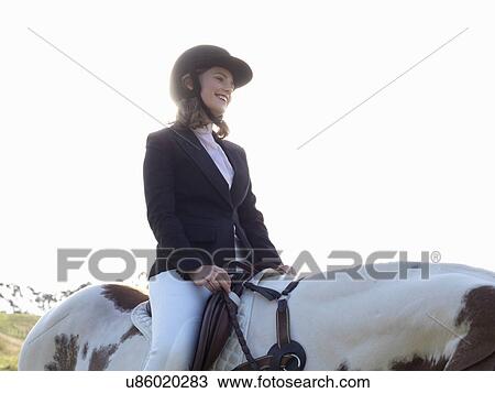 Teenage girl riding horse View Large Photo Image Stock Image - Teenage girl riding horse. Fotosearch