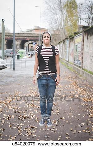 Teenager jumping on street View Large Photo Image Stock Photo - Teenager jumping on street. Fotosearch