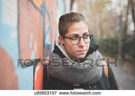 Teenager leaning against graffiti wall View Large Photo Image Stock Photo - Teenager leaning against graffiti wall. Fotosearch