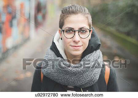 "Teenager on street, graffiti wall in background" View Large Photo Image Stock Image - "Teenager on street, graffiti wall in background". Fotosearch