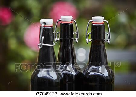 "Three beer bottles, close up" View Large Photo Image Stock Image - "Three beer bottles, close up". Fotosearch