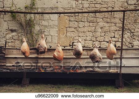 Traditional french roasting of hams View Large Photo Image Stock Photo - Traditional french roasting of hams. Fotosearch